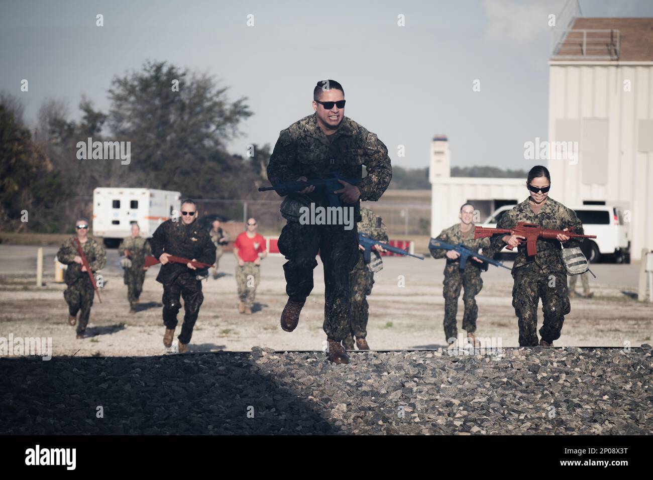 U.S. Navy corpsmen run towards a medical evacuation site during