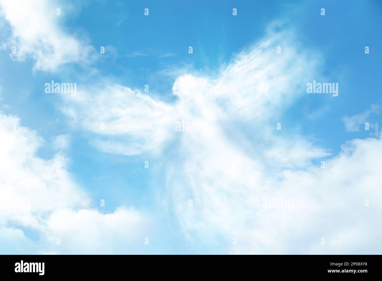 Silhouette of angel made of clouds in blue sky Stock Photo - Alamy