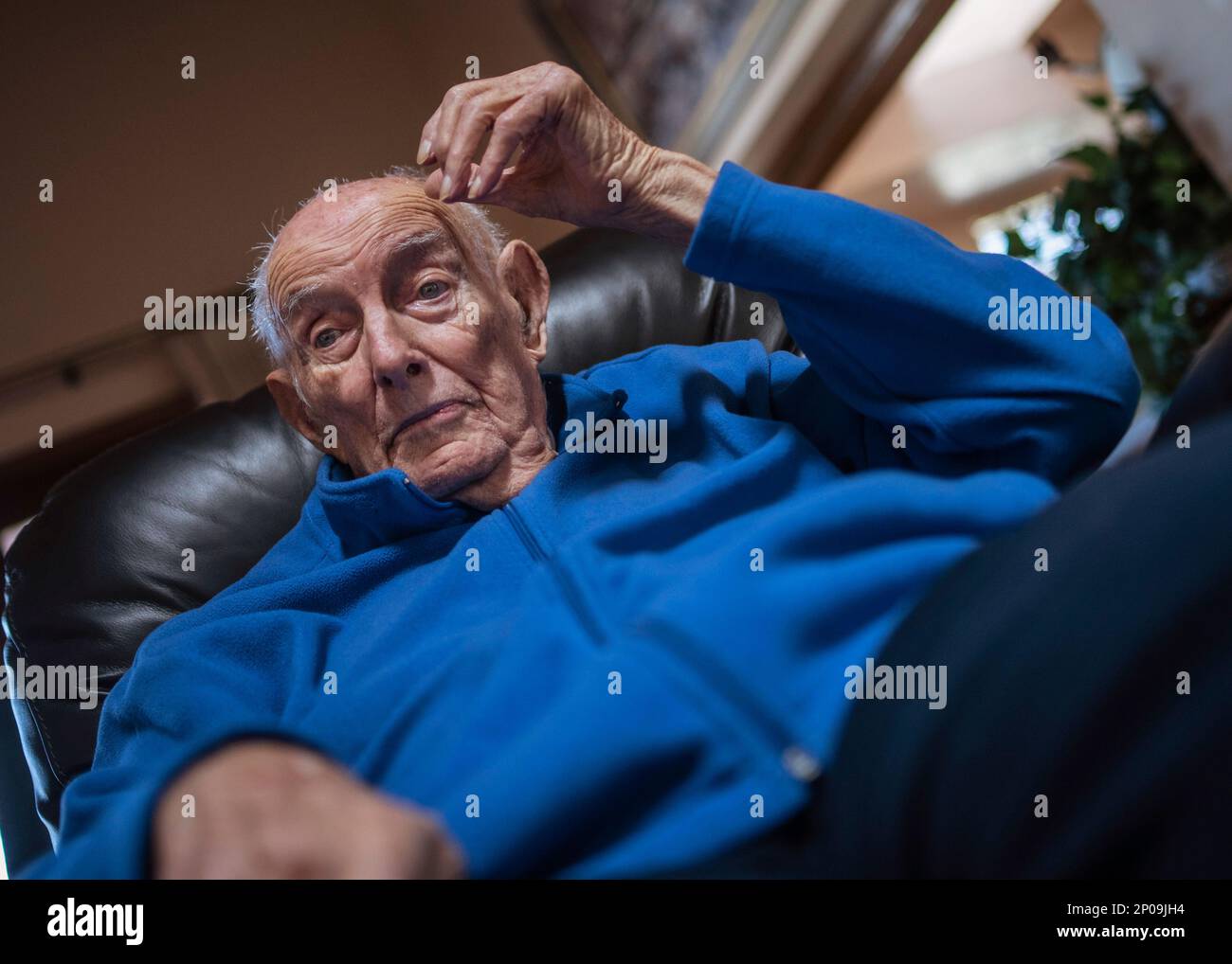 World War II combat veteran Jim Wilson is interviewed by Rishi Sharma at Wilson's his home in Albuquerque, N.M., on Monday, Jan. 30, 2017. Wilson, 95, is likely the last remaining Army paratrooper who helped liberate 2,147 civilian and military prisoners being held by their Japanese captors at the Los Baños internment camp in the Philippines. Sharma is a 19-year-old Californian who is on a mission to interview as many World War II combat veterans as he can. (Roberto E. Rosales/The Albuquerque Journal via AP) Stock Photo