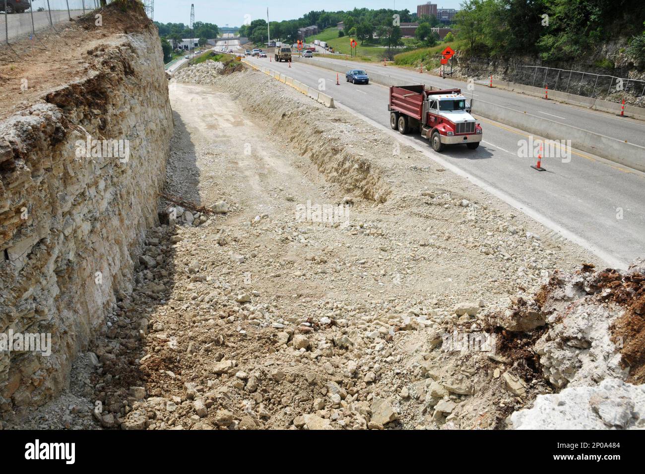 Heavy equipment operators from Emery Sapp and Sons continue to dig down ...
