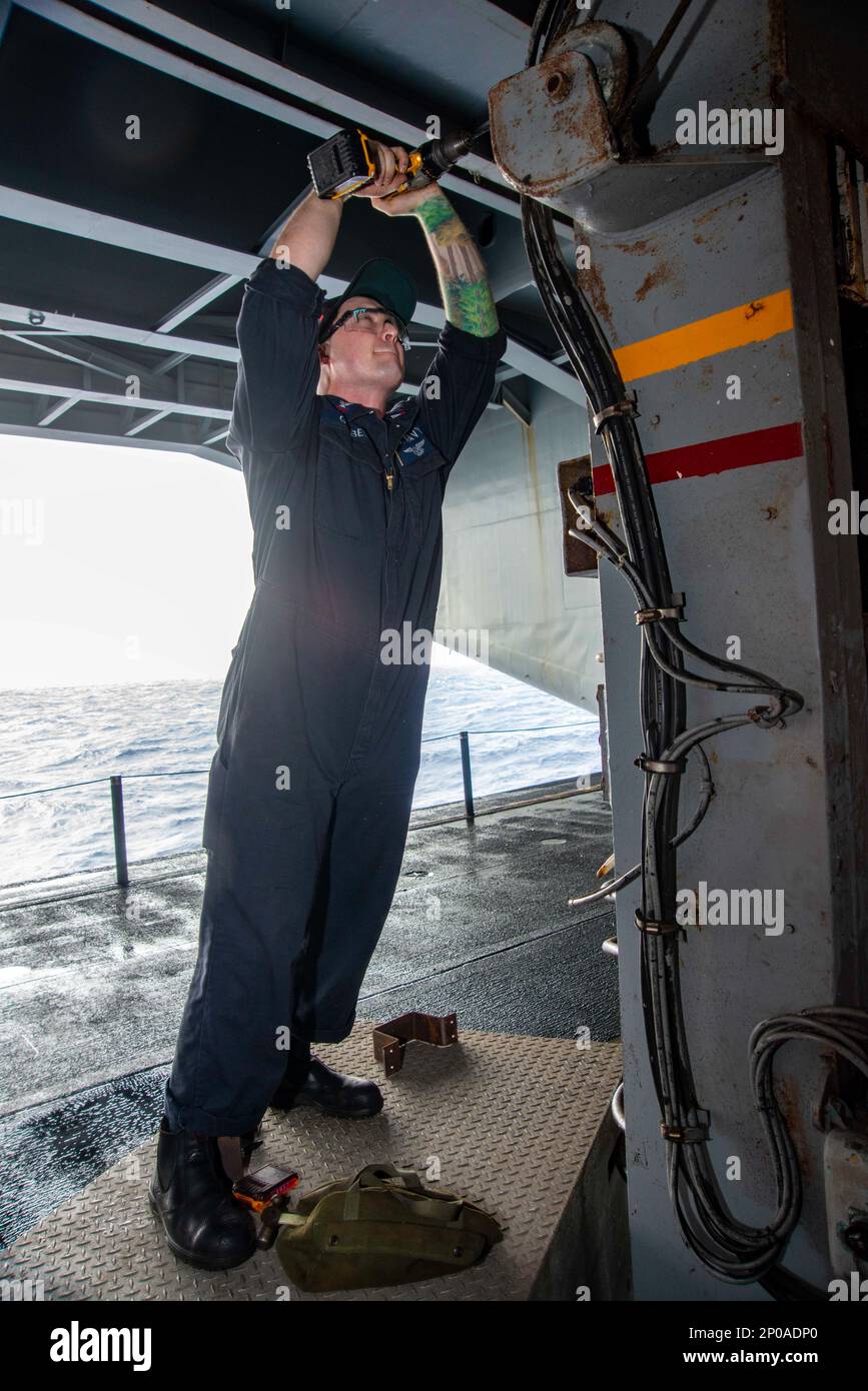 https://c8.alamy.com/comp/2P0ADP0/230105-n-nx635-1181-philippine-sea-jan-5-2023-us-navy-machinery-repairman-2nd-class-james-goebel-from-temecula-calif-adds-protective-wire-coverings-to-a-sliding-padeye-station-in-the-hangar-bay-aboard-the-aircraft-carrier-uss-nimitz-cvn-68-nimitz-is-in-7th-fleet-conducting-routine-operations-7th-fleet-is-the-us-navys-largest-forward-deployed-numbered-fleet-and-routinely-interacts-and-operates-with-35-maritime-nations-in-preserving-a-free-and-open-indo-pacific-region-2P0ADP0.jpg