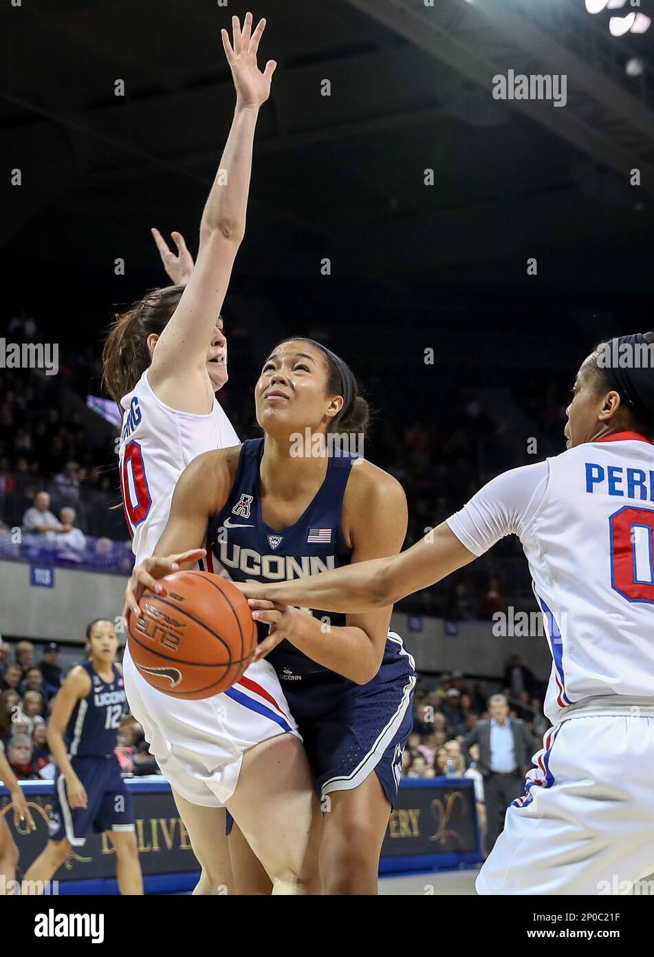 UNIVERSITY PARK, TX - JANUARY 14: Connecticut forward Napheesa Collier (c)  gets fouled on the play by SMU Kiara Perry (0) during the NCAA women's  basketball game between the Connecticut Huskies and