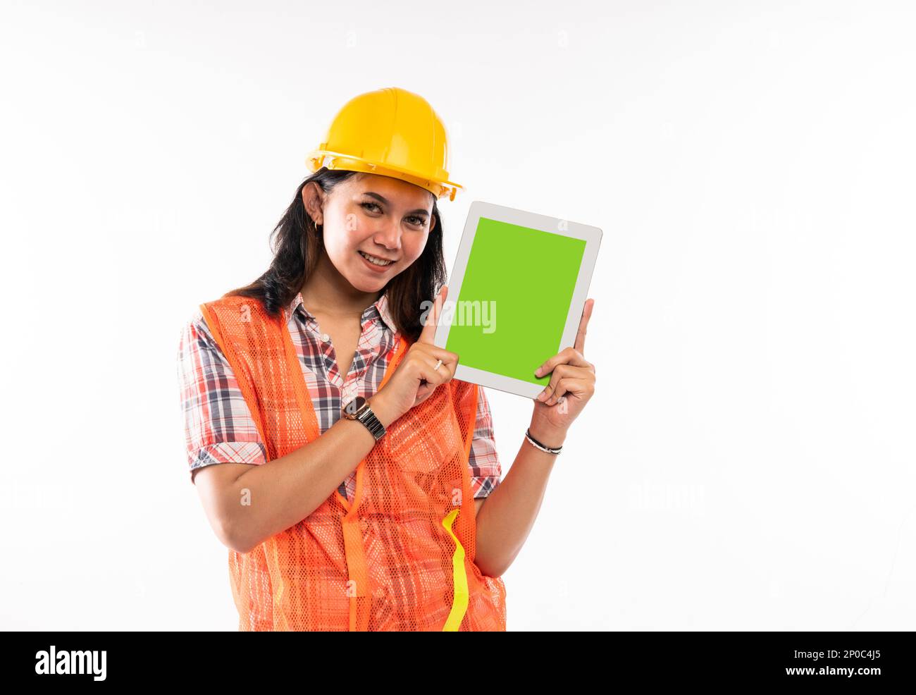 a female architect showing the digital tablet with green screen Stock Photo