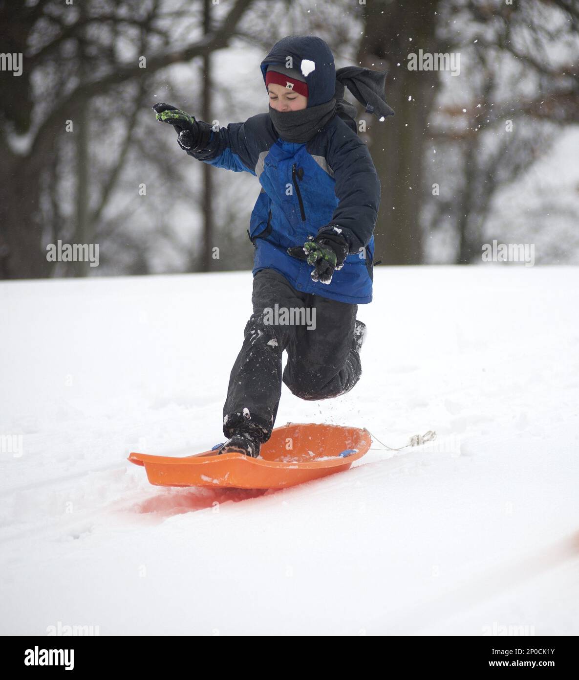 Wheatley Rodammer, 9, of Indiantown in Saginaw County's Buena Vista Township, jumps onto his