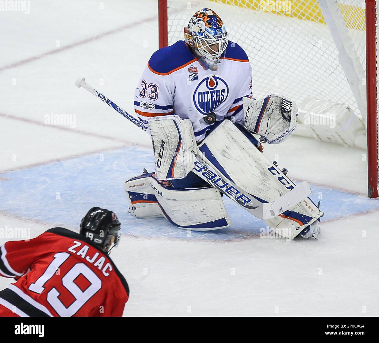 January 7 2017 Edmonton Oilers goalie Cam Talbot 33 stops New Jersey Devils center Travis Zajac 19 during an NHL hockey game between the Edmonton Oilers and the New Jersey Devils at