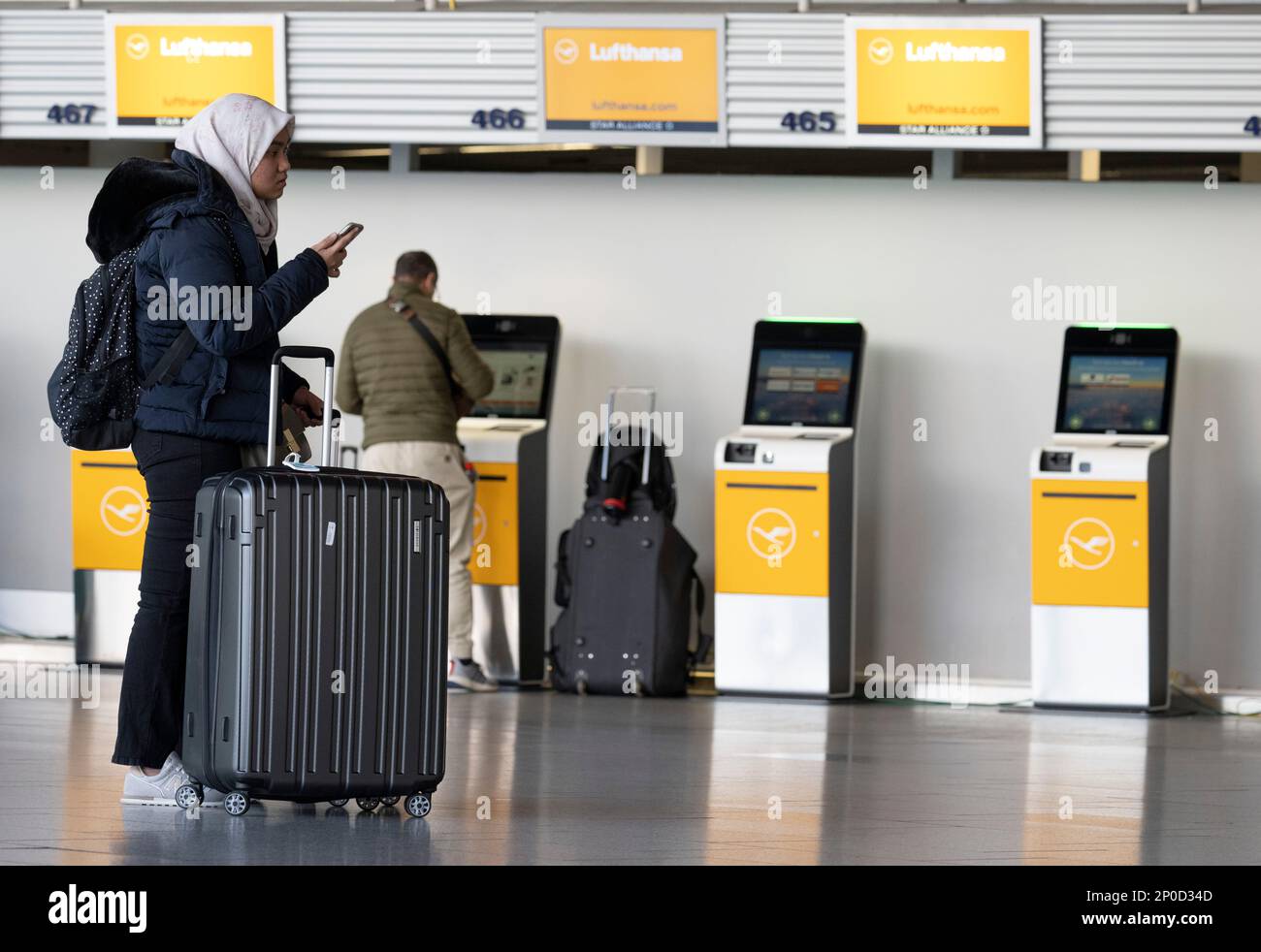 28 February 2023, Hesse, Frankfurt/Main Passengers stand at the