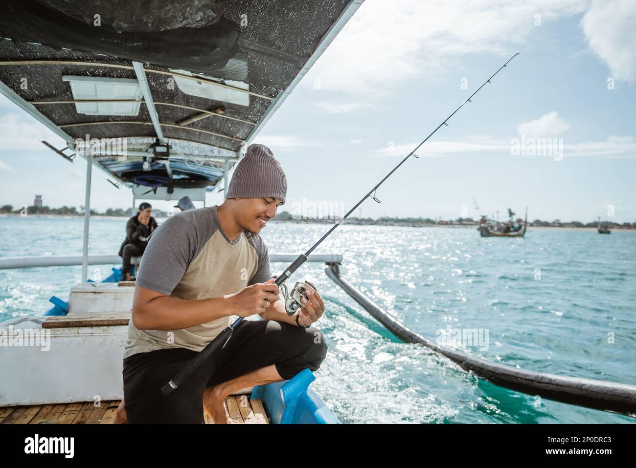 Happy asian male angler hi-res stock photography and images - Alamy