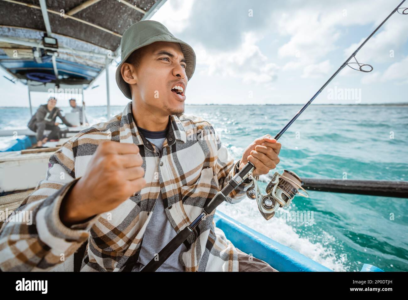 Happy asian male angler hi-res stock photography and images - Alamy