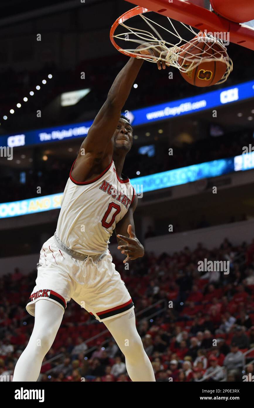 RALEIGH, NC - DECEMBER 28: North Carolina State Wolfpack guard Dennis Smith  Jr. (4) drives around Rider Broncs forward Xavier Lundy (11) during the  game between the Rider Broncs and the North