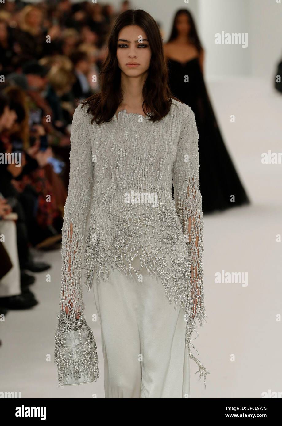 A model wears a creation as part of the Chanel Fall/Winter 2023-2024  ready-to-wear collection presented Tuesday, March 7, 2023 in Paris.  (Vianney Le Caer/Invision/AP Stock Photo - Alamy