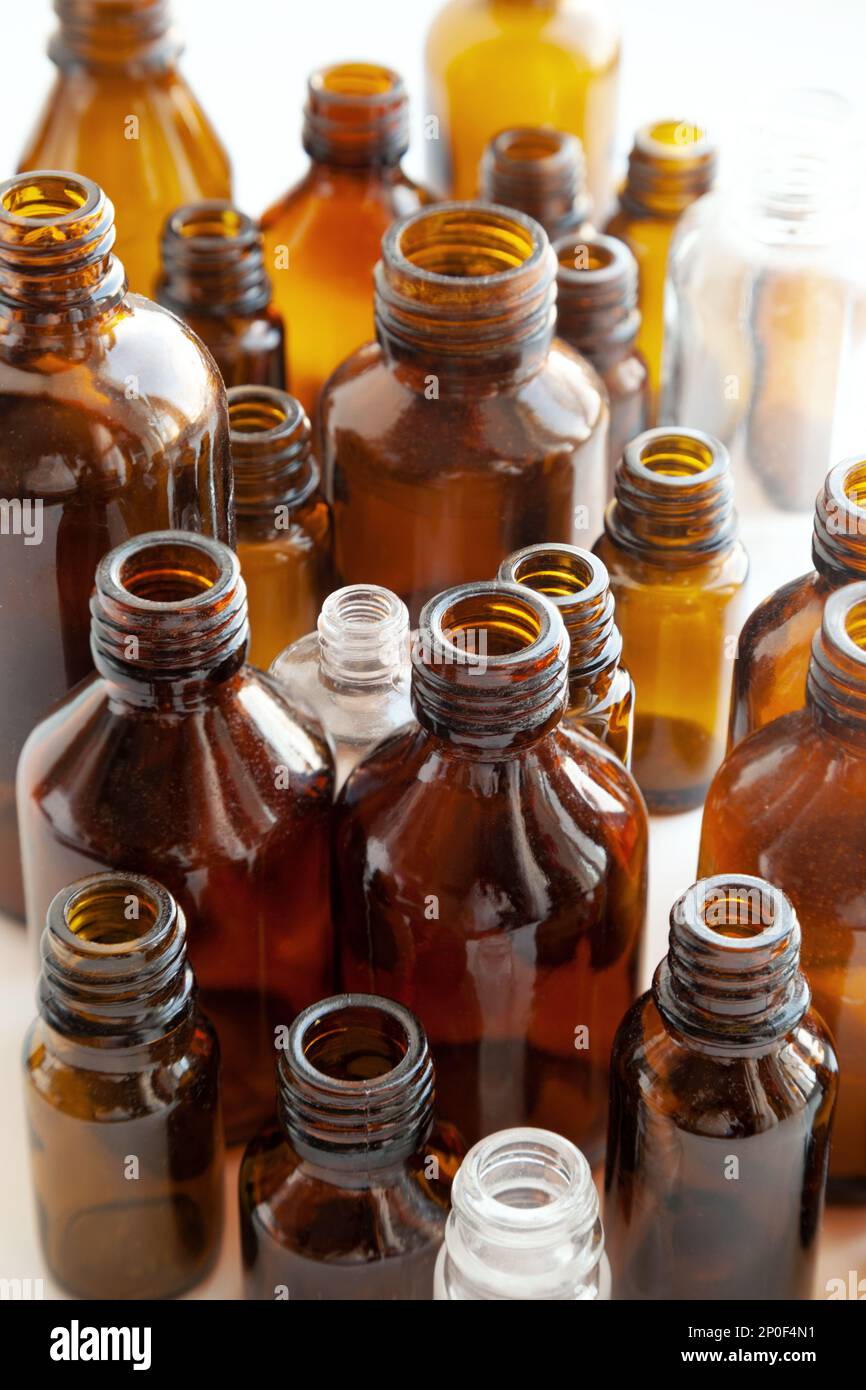 Group of various medical vials background. Many small brown bottles without labels Stock Photo