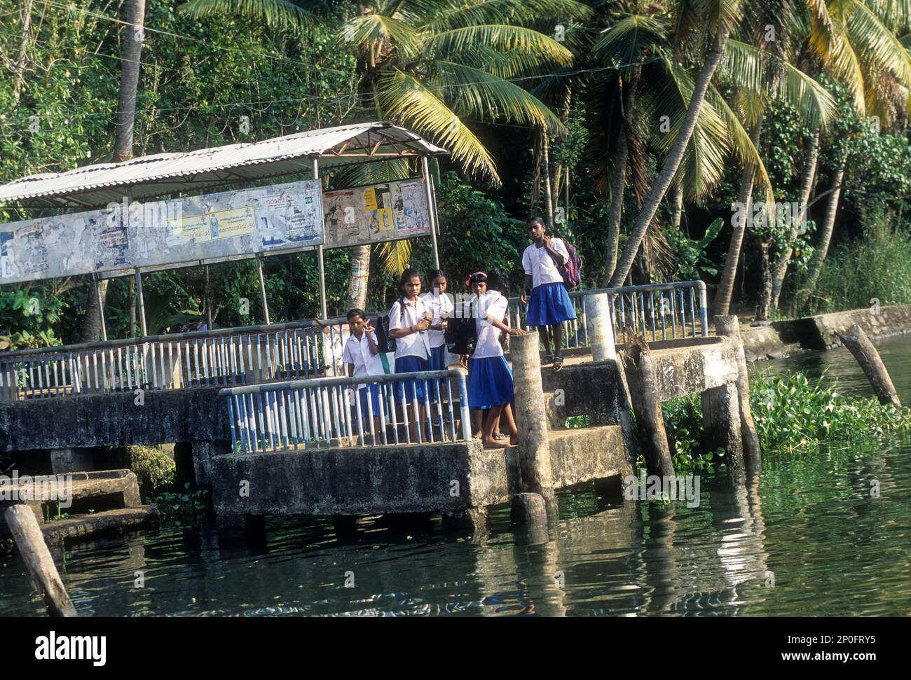 Girls Waiting boat jetty for a passenger boat near Alappuzha, Alleppey