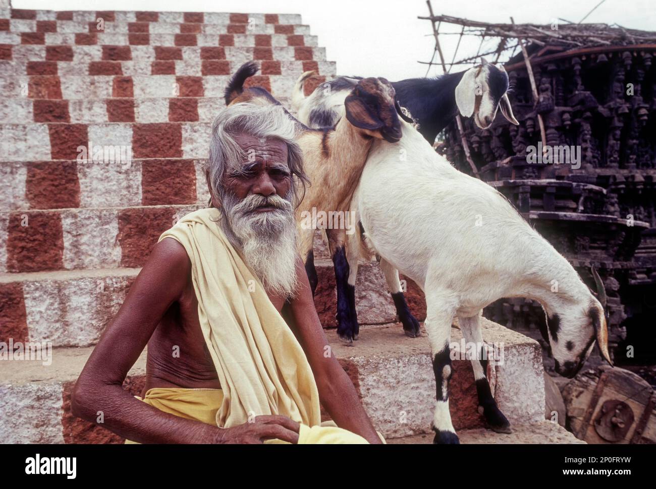 S.Rajasamy; elderly male Hindu beggar sitting on the steps of Perur