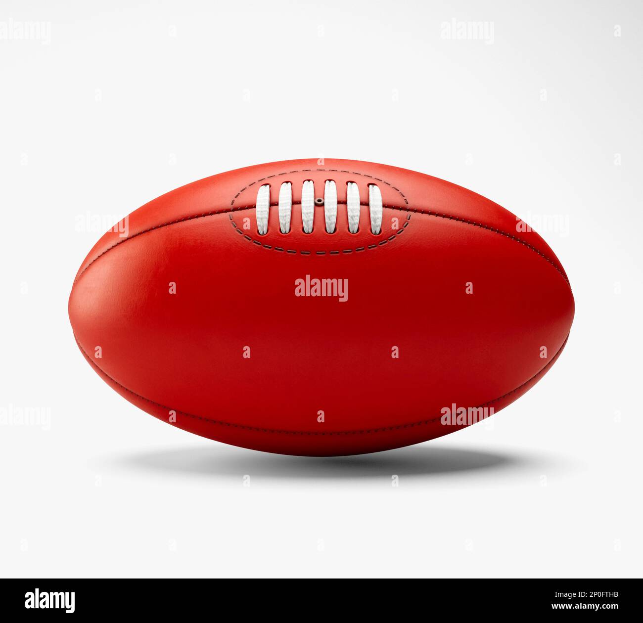 A generic unbranded aussie rules football ball on an isolated studio
