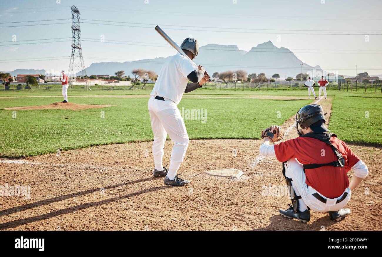 Baseball batter, game or sports man on field at competition, training match on a stadium pitch. Softball exercise, fitness workout or back view of Stock Photo