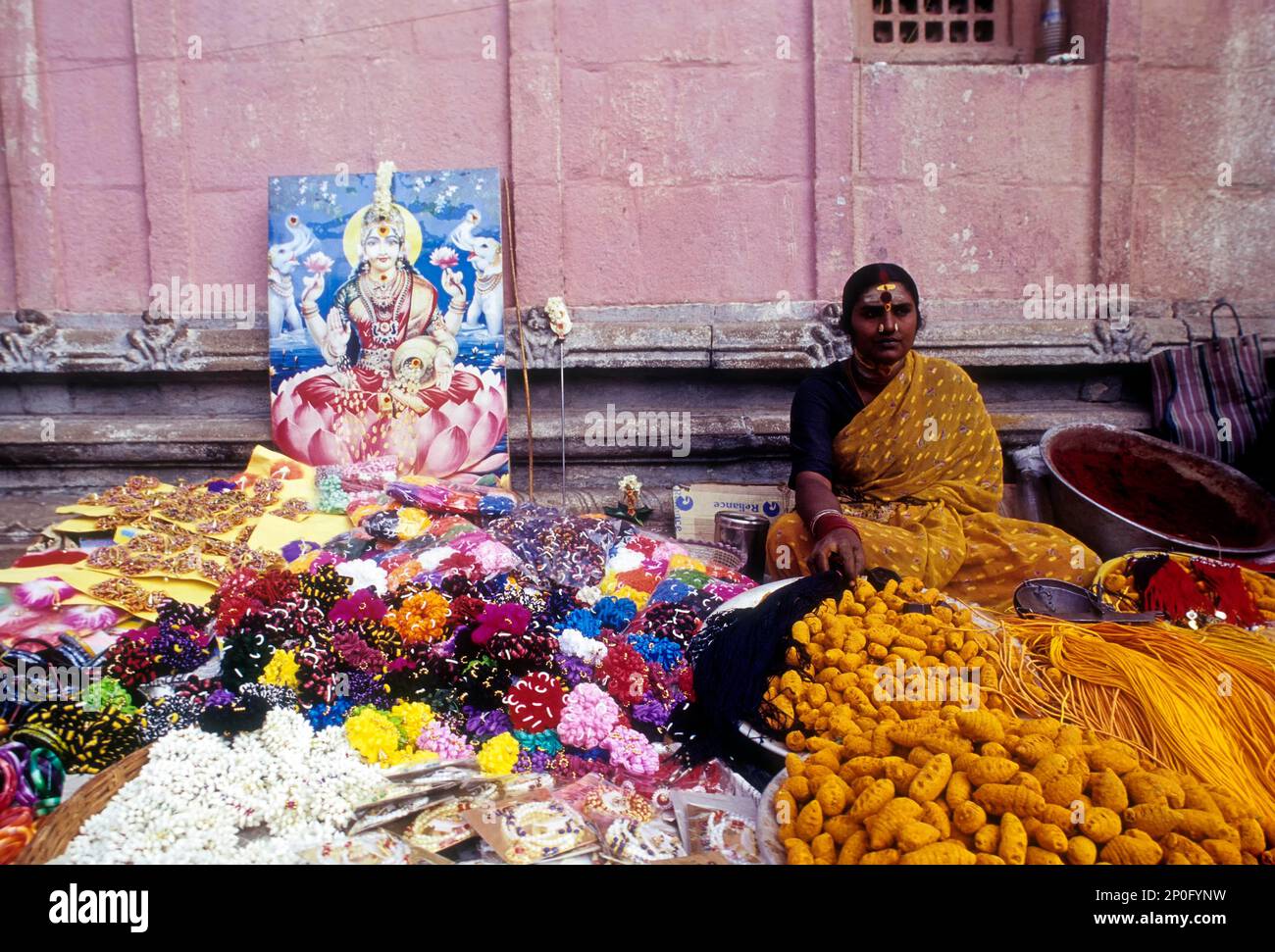 Woman selling religious offerings in Palani temple premises, Tamil Nadu, India, Asia Stock Photo