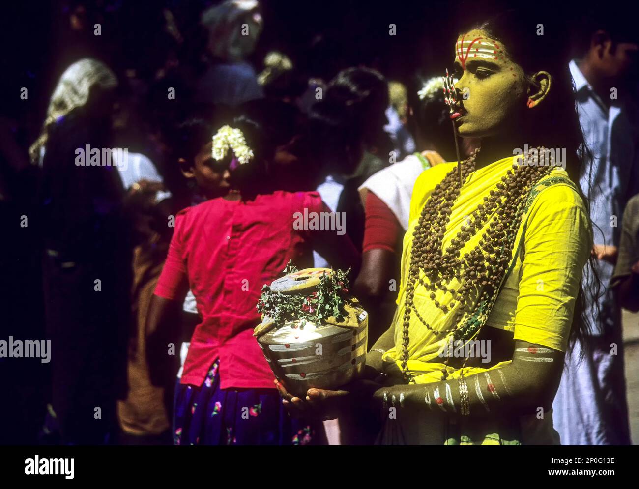 Godly Attire Shiva devotee with pierced tongue and the symbol of Shiva the trident in Kodungallur, Kerala, South India, India, Asia Stock Photo