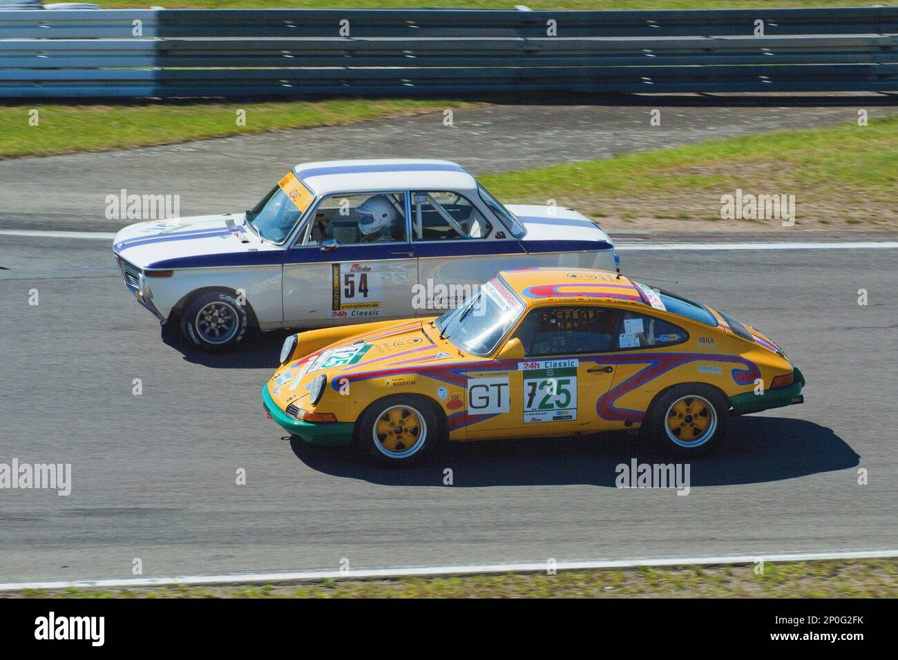 Porsche 911, BMW 2002i, Nuerburgring race track, 24h Classic, curves, curbes, tracks, race track, track, youngtimer trophy, classic car, 70ies Stock Photo