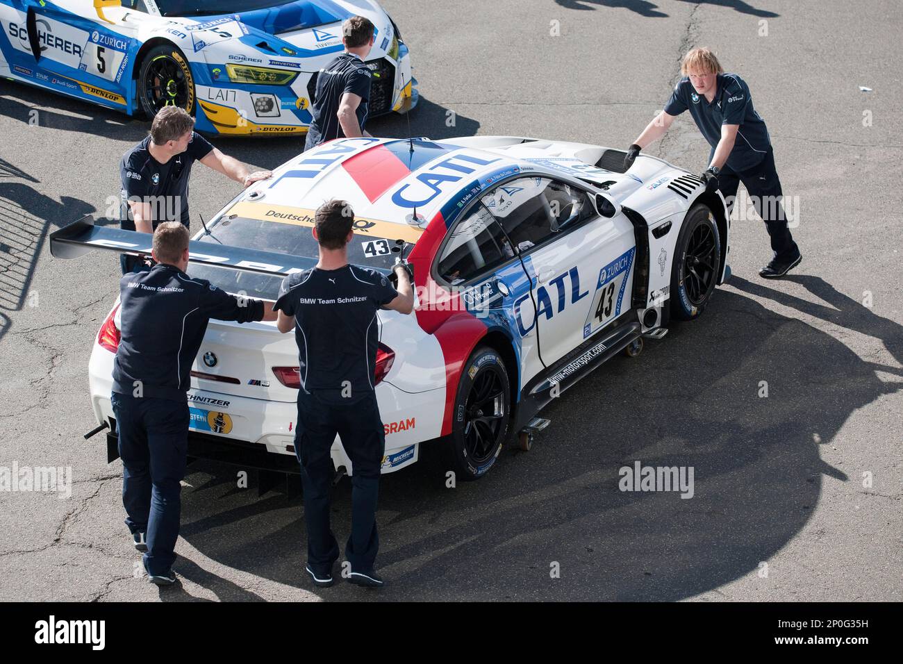 Race car BMW M6 GT3, mechanics pushing car, technical check before race, racing, race car, Nuerburgring 24h race 2017, Eifel, Rhineland-Palatinate Stock Photo