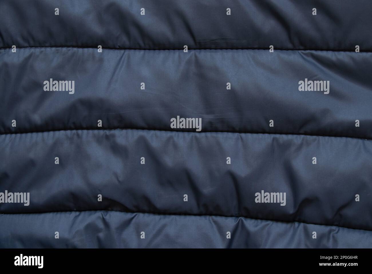 black puffer jacket material as background Stock Photo - Alamy