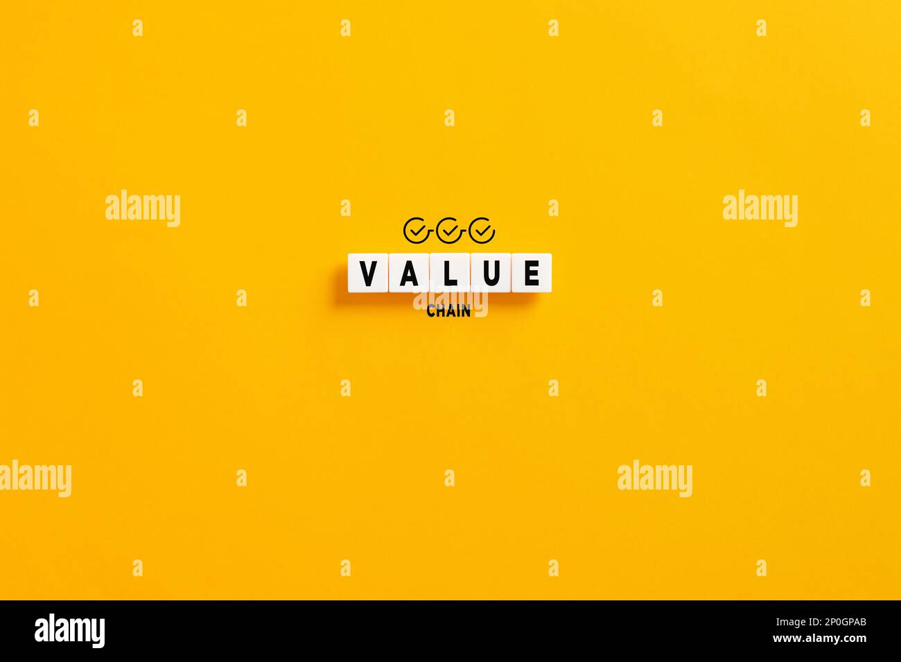 White letter blocks on yellow background with the word value chain. Business manufacturing process and industry development analysis. Stock Photo