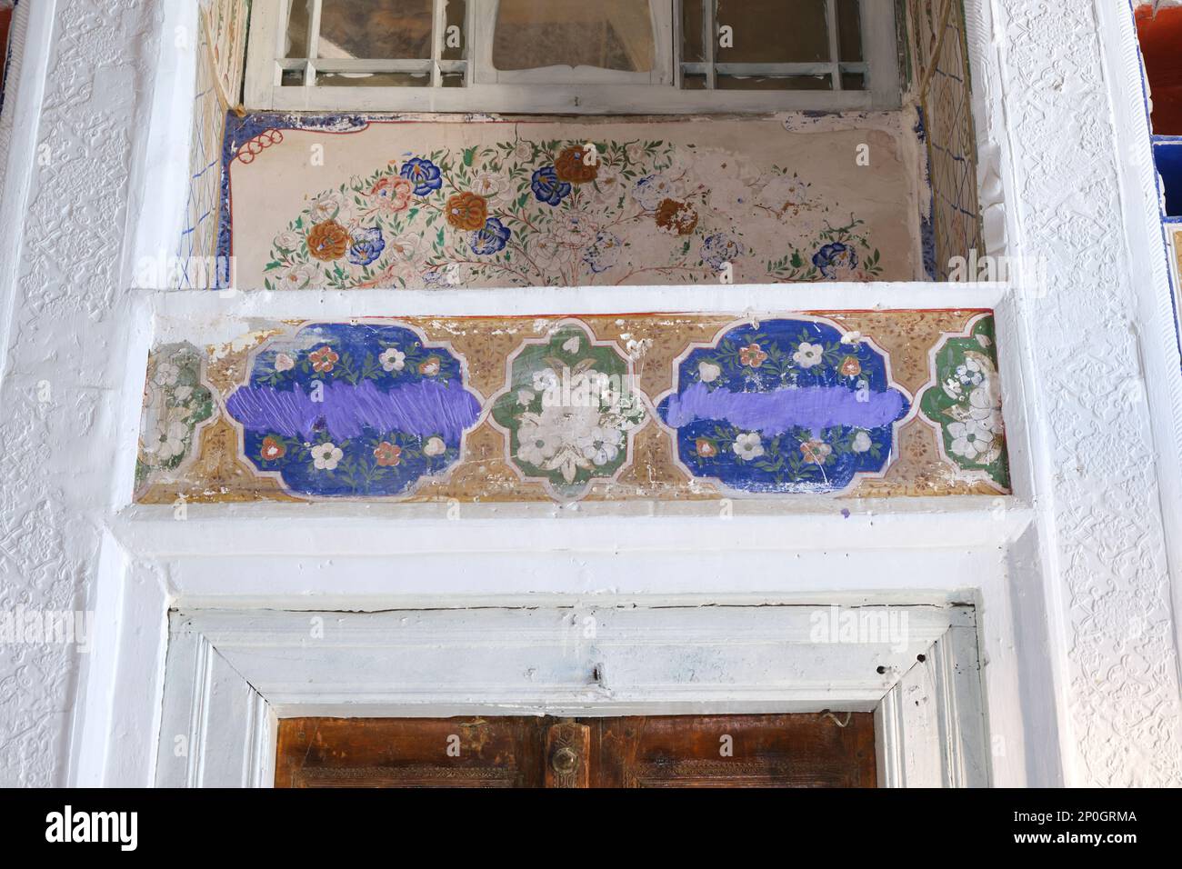 Detail of colorful, painted wall section at a renovated grand