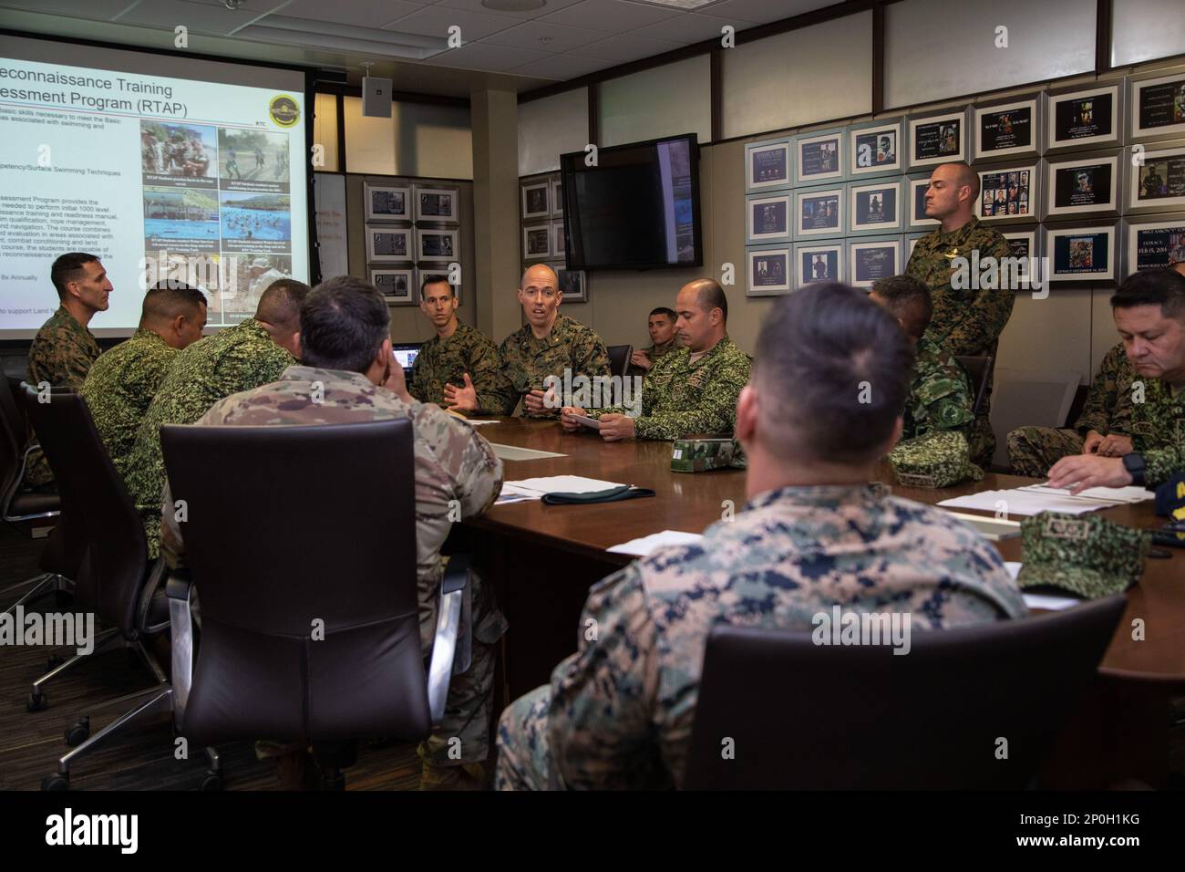 U.S. Marine Corps Maj. Jordan Morgan, company commander at Infantry Training Battalion School of Infantry - West briefs Colombian military leadership about expeditionary operations training group during a visit to Marine Corps Base Camp Pendleton, California, Feb. 15, 2023. The visit is designed to reinforce strategic relationships between senior Colombian military and senior Marine Corps leadership. During the visit, Marine Corps leaders briefed senior Colombian leadership about tactical concepts and general strategy. Stock Photo