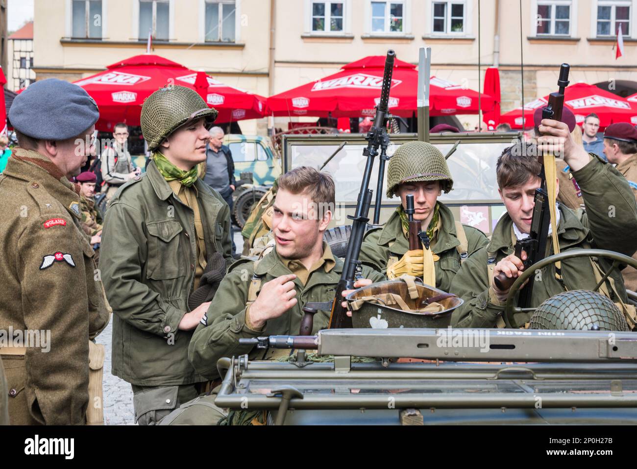 Reenactors in Polish and US army uniforms before reenactment of WW2 battle, City Hall Square in Jelenia Góra, Lower Silesia, Poland Stock Photo