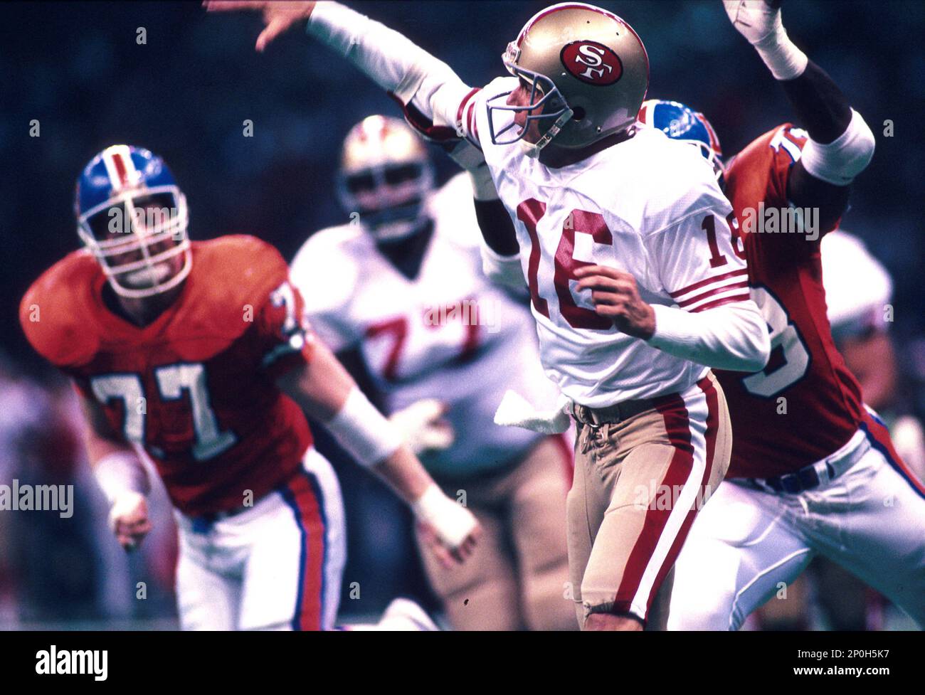 28 Jan 1990: Quarterback Joe Montana of the San Francisco 49ers is chased  during the 49ers 55-10 victory over the Denver Broncos in Super Bowl XXIV  at the Louisiana Superdome in New