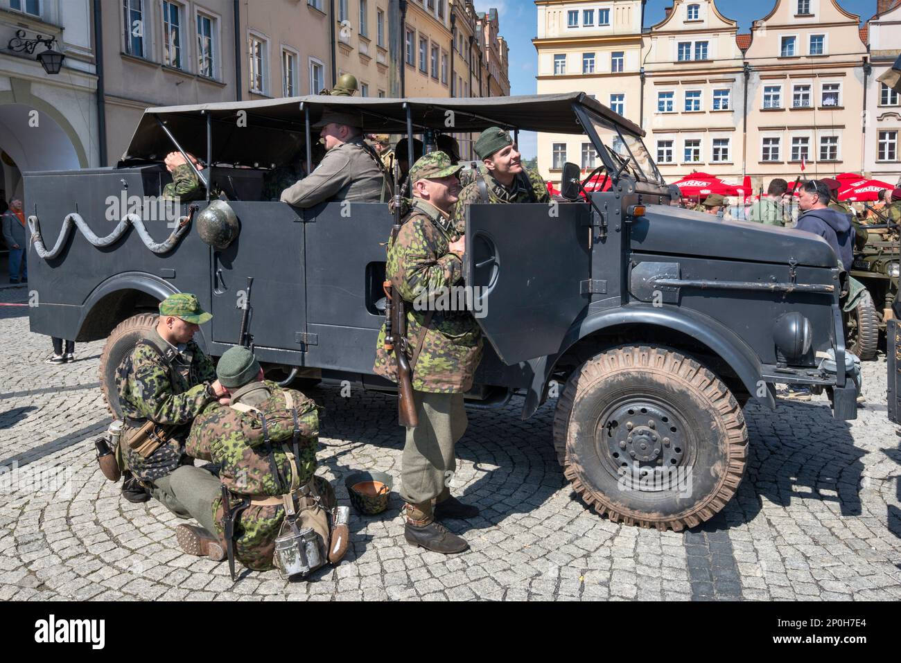 Steyr 1500 truck, reenactors in Waffen-SS German uniforms, before reenactment of WW2 battle, City Hall Square in Jelenia Góra, Lower Silesia, Poland Stock Photo