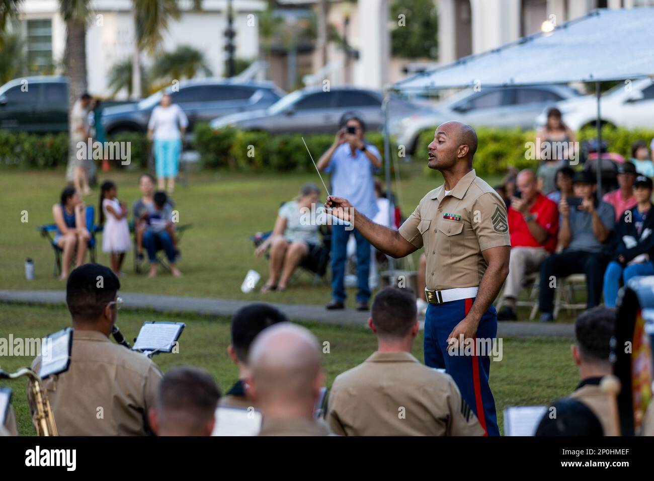 U.S. Marine Corps Staff Sgt. Uiliami Fihaki, an enlisted conductor with Marine Corps Forces Pacific Band, conducts a performance during a live concert for the local community at Plaza de Espana, Hagatna, Guam, Jan. 23, 2023. The MARFORPAC Band participated in multiple community engagements during their visit to Guam as part of the Naval Support Activity, Marine Corps Base Camp Blaz Reactivation and Naming Ceremony. In order to encourage music education and showcase the vibrant history and tradition of military music, the band is active in providing clinics and concerts for the communities they Stock Photo