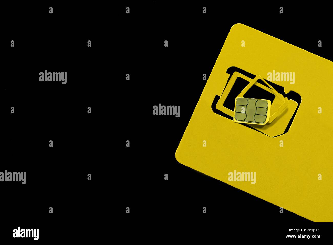 Multi SIM card on black background, top view. Space for text Stock Photo