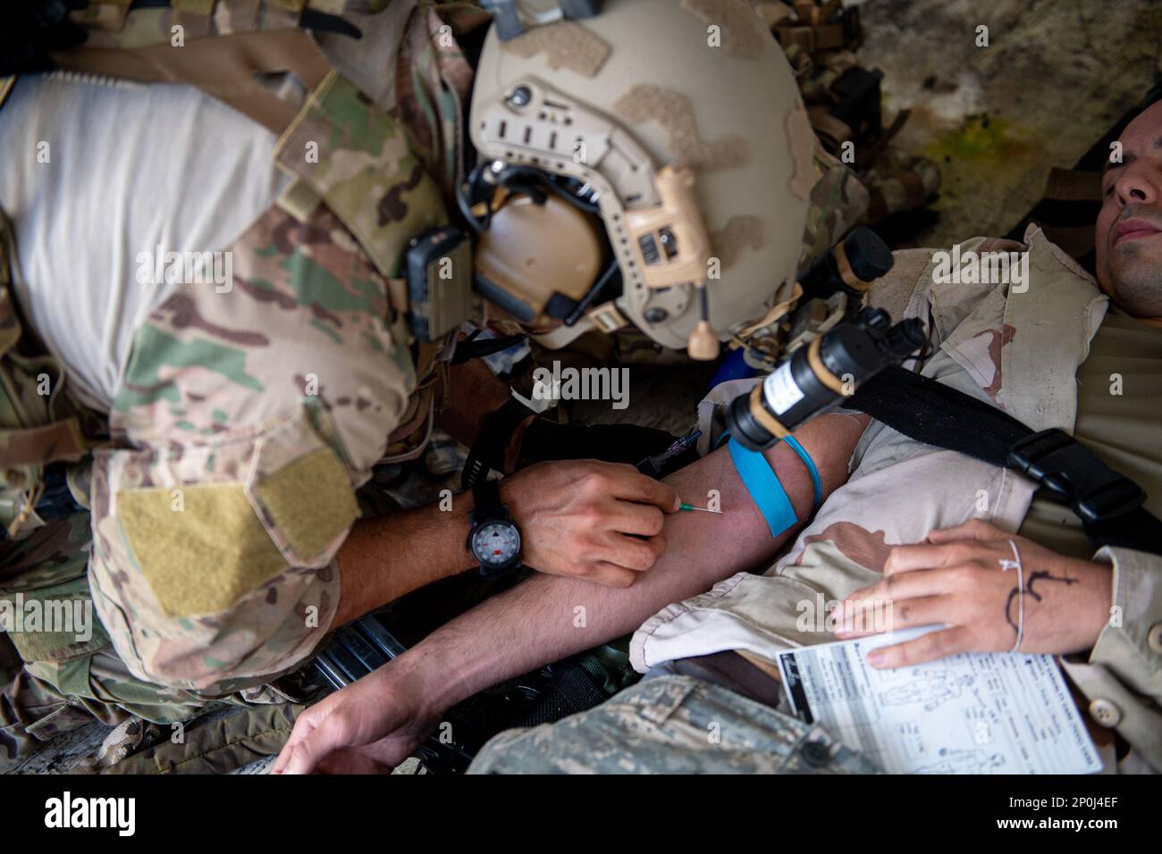 A U.S. Air Force Pararescueman from the 38th Rescue Squadron triages a