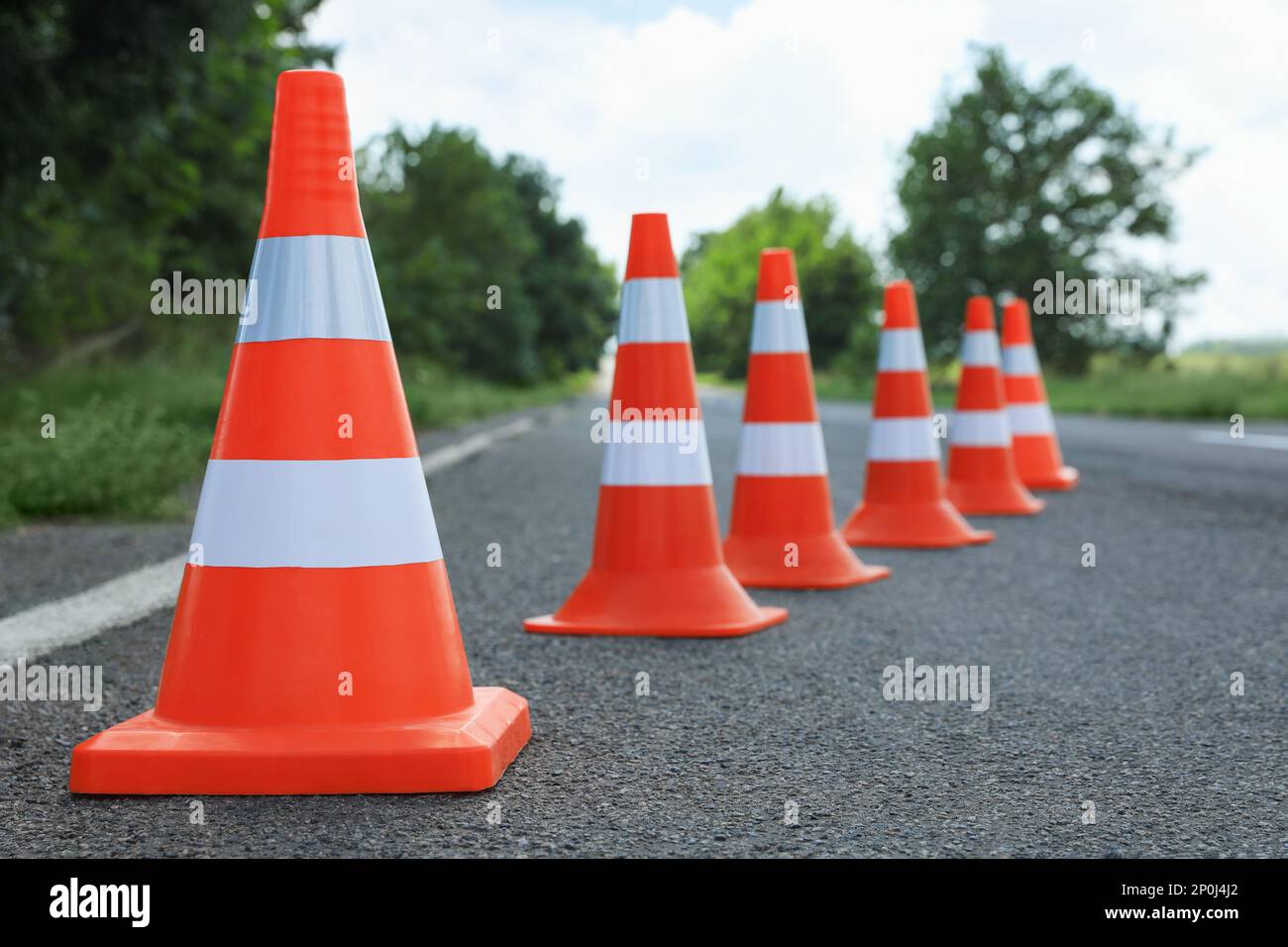 Traffic cones on asphalt highway. Road repair Stock Photo - Alamy