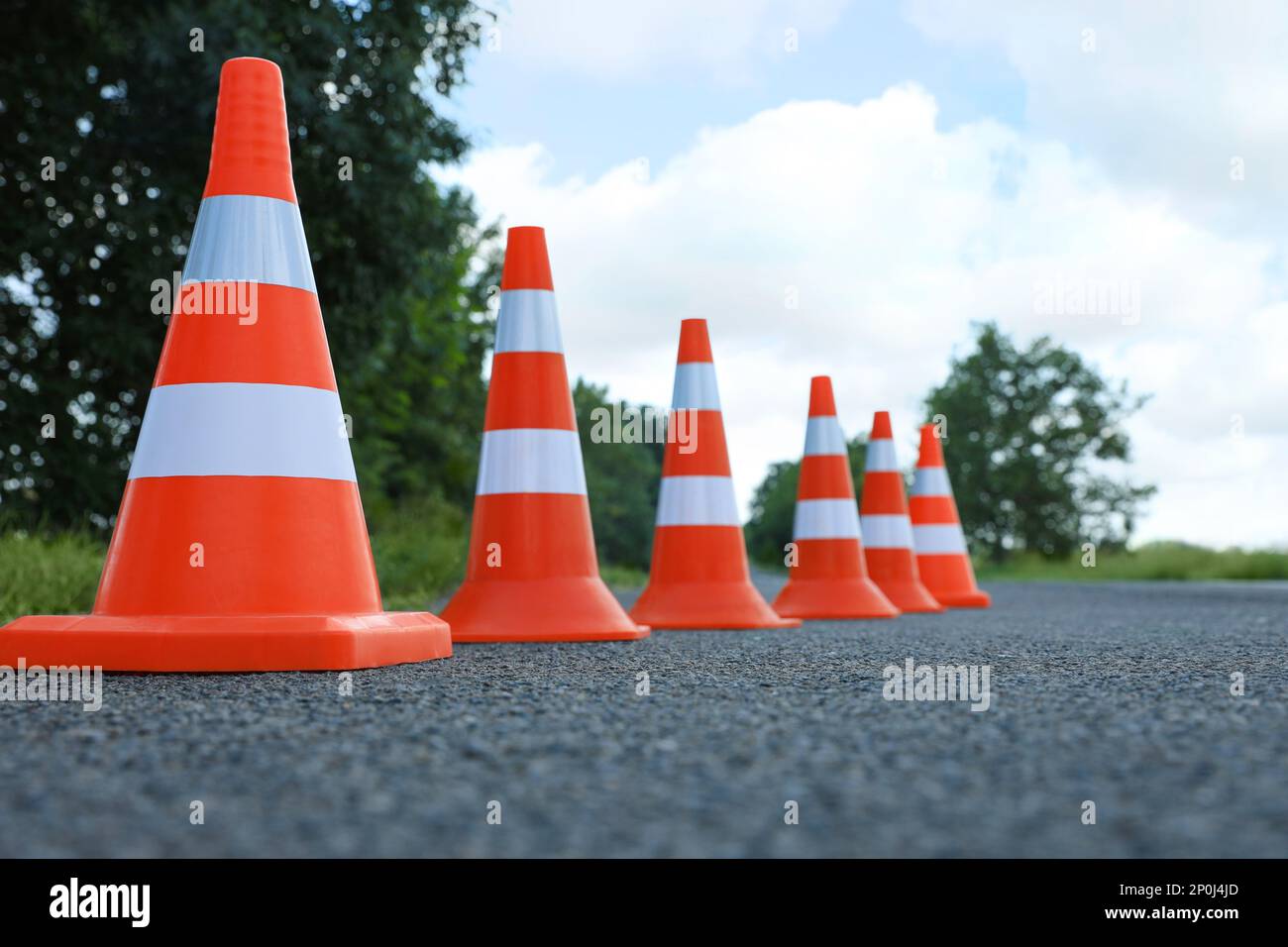Traffic cones on asphalt highway. Road repair Stock Photo - Alamy