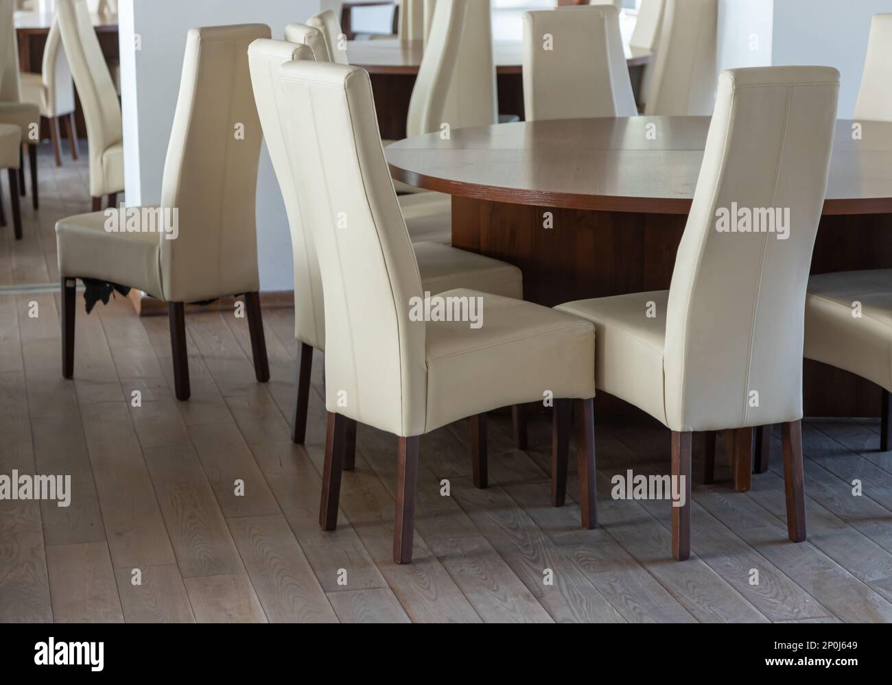 Abstract modern interior of cafe or meeting room with rounded armchairs. Stock Photo