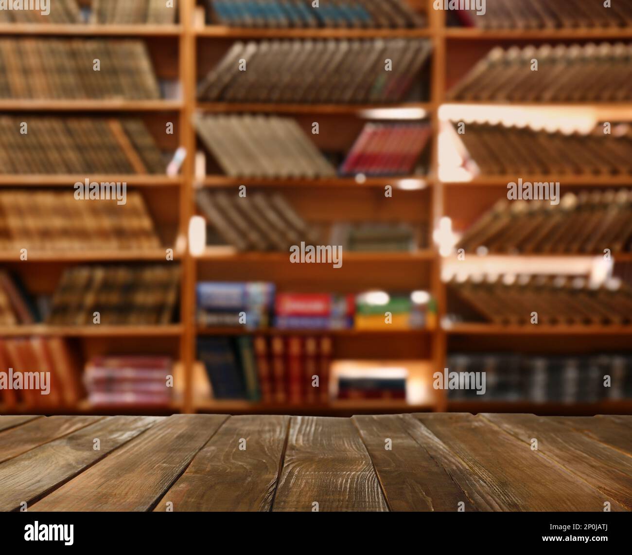 Empty wooden table in library. Space for design Stock Photo - Alamy