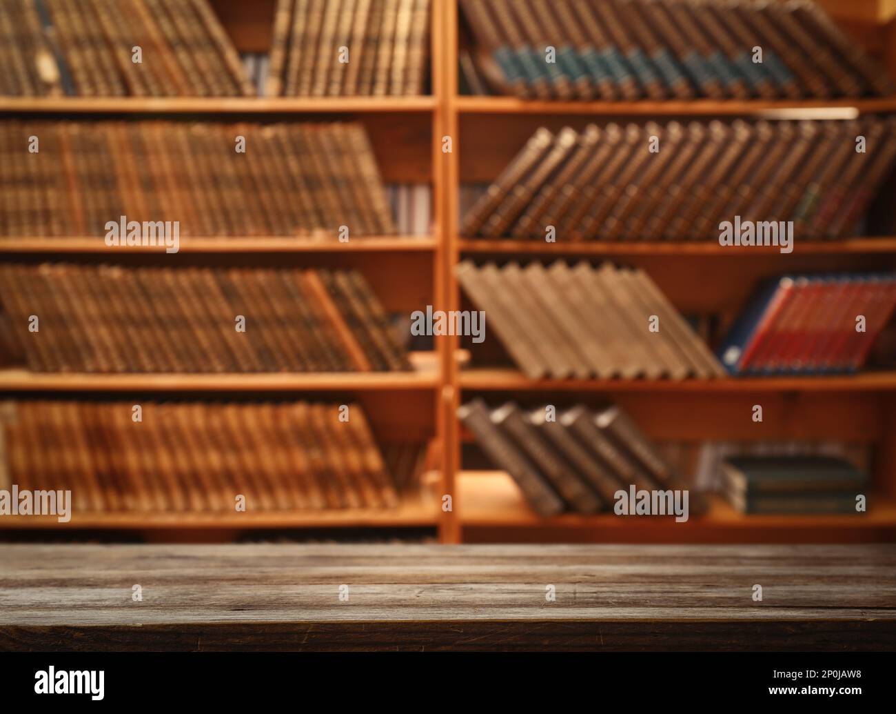 Empty wooden table in library. Space for design Stock Photo - Alamy