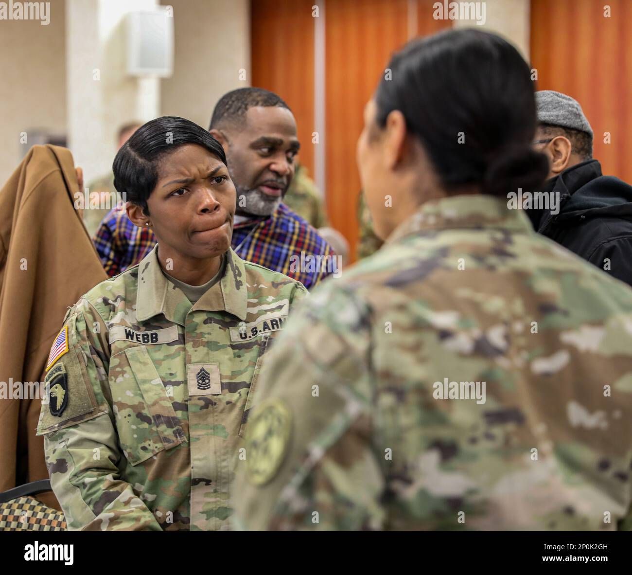 Sgt. Maj. Nonya Webb speaks with Capt. Devan Icsman following Dr. Martin Luther King, Jr. prayer breakfast on Caserma Ederle. The event was an opportunity for Soldiers and civilians to reflect on past injustices King fought during the civil rights movement and highlight diversity in today's Army. Stock Photo