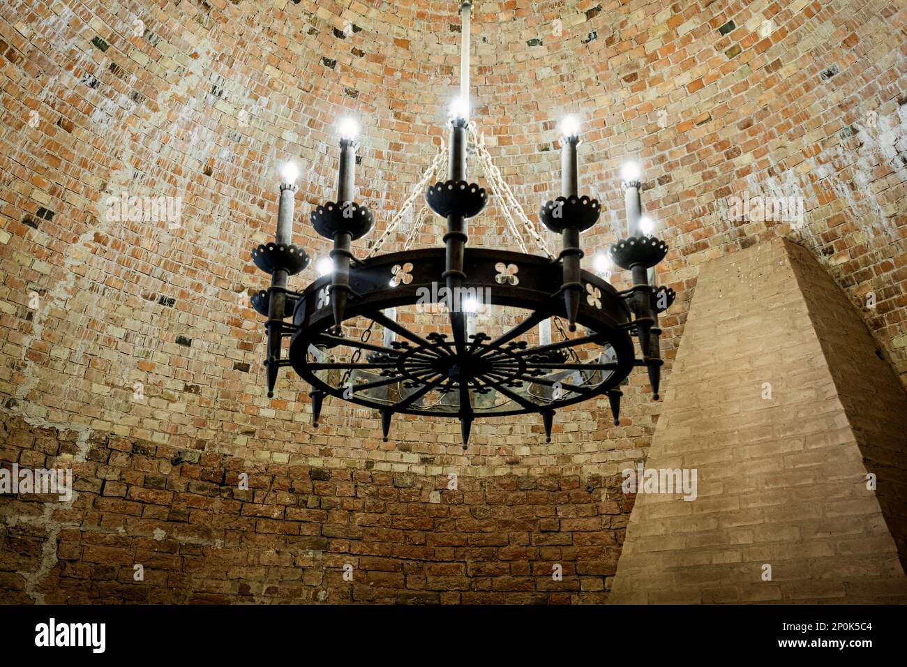 Big vintage chandelier in Interior old tower of the Turaida Castle. Brick ceiling Stock Photo ...