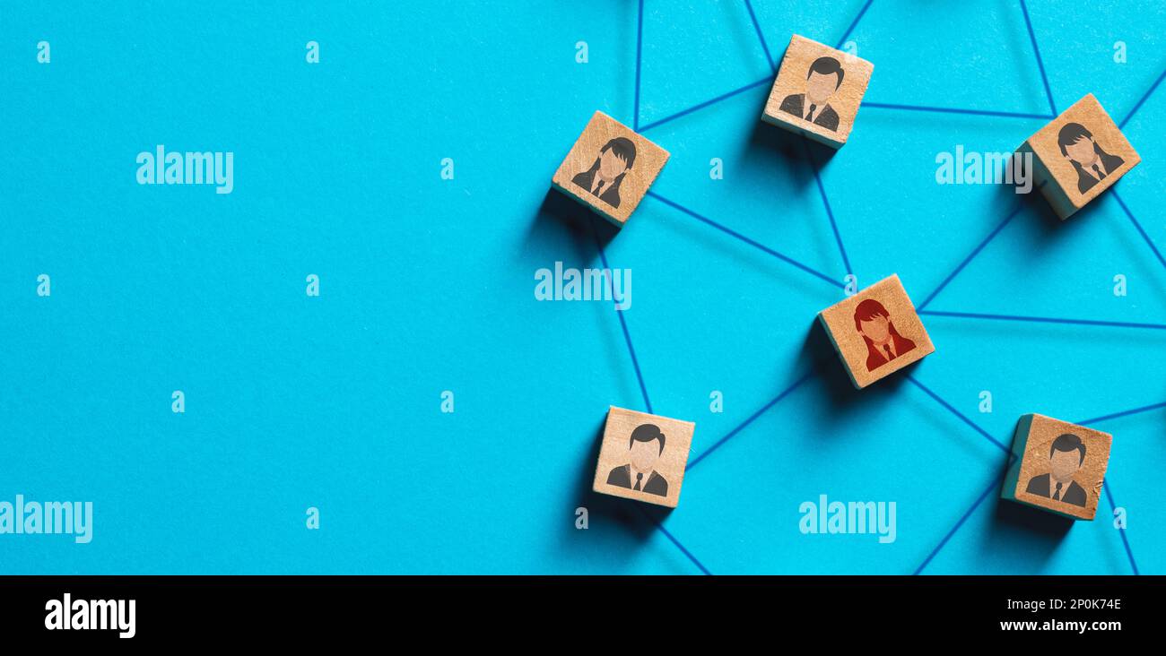 Organization structure, social network and teamwork concept on blue background. Business people icon on wooden cube blocks connecting network of conne Stock Photo