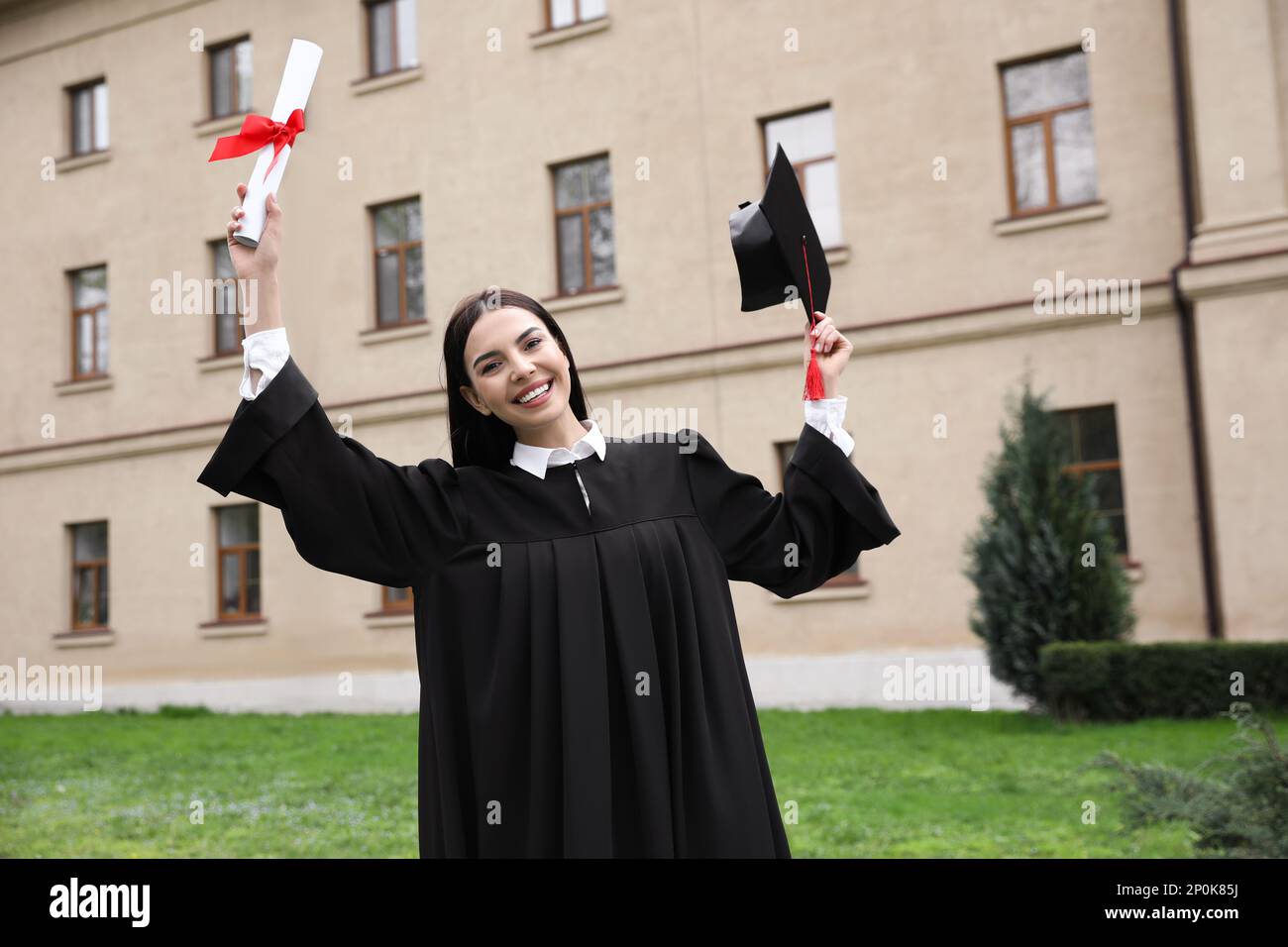 Happy student with diploma after graduation ceremony outdoors Stock ...