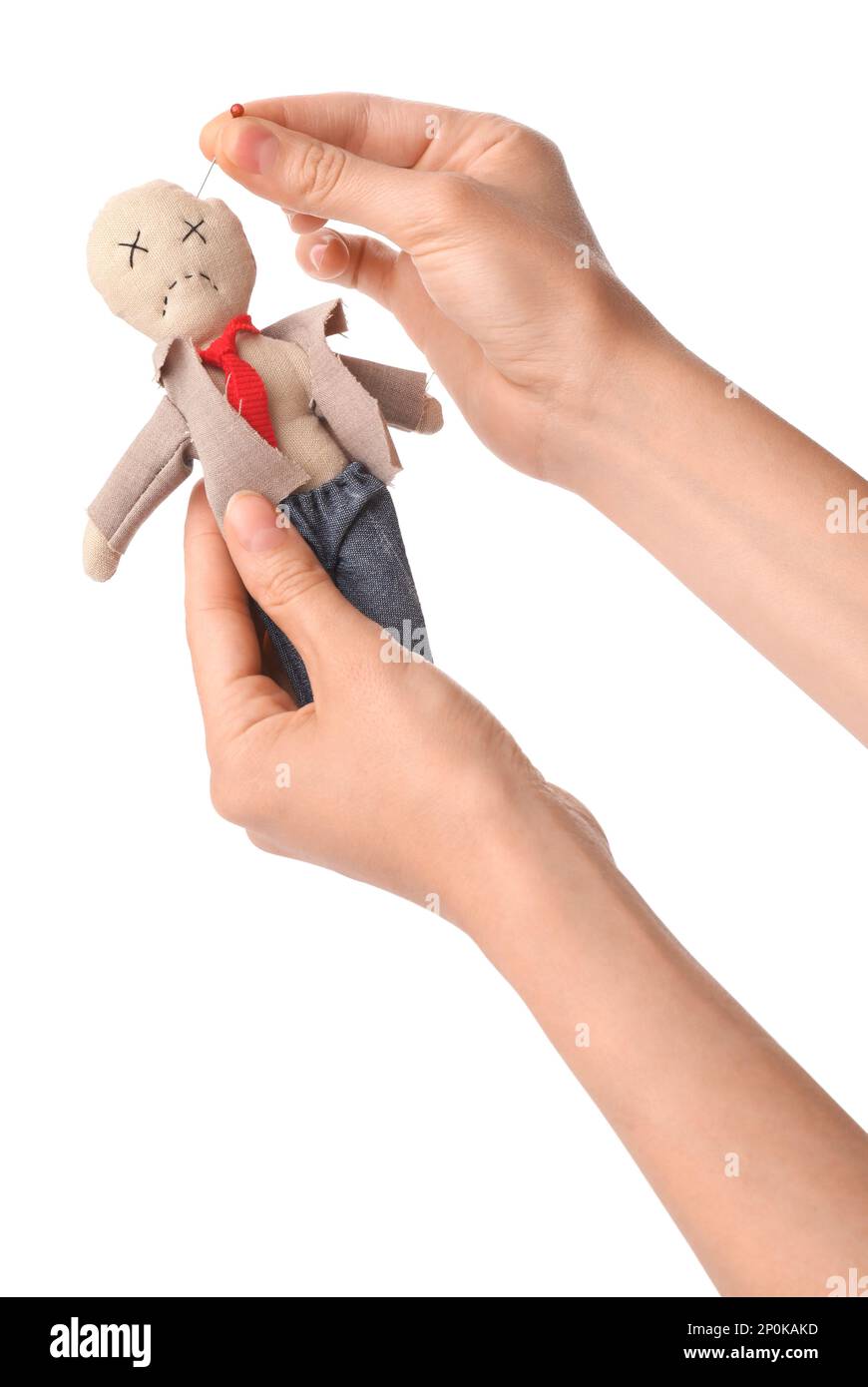 Woman stabbing voodoo doll dressed as businessman with pin on white