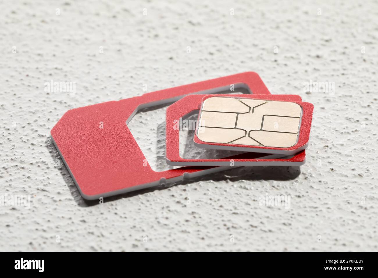 Multi SIM card on stone background, closeup Stock Photo Alamy