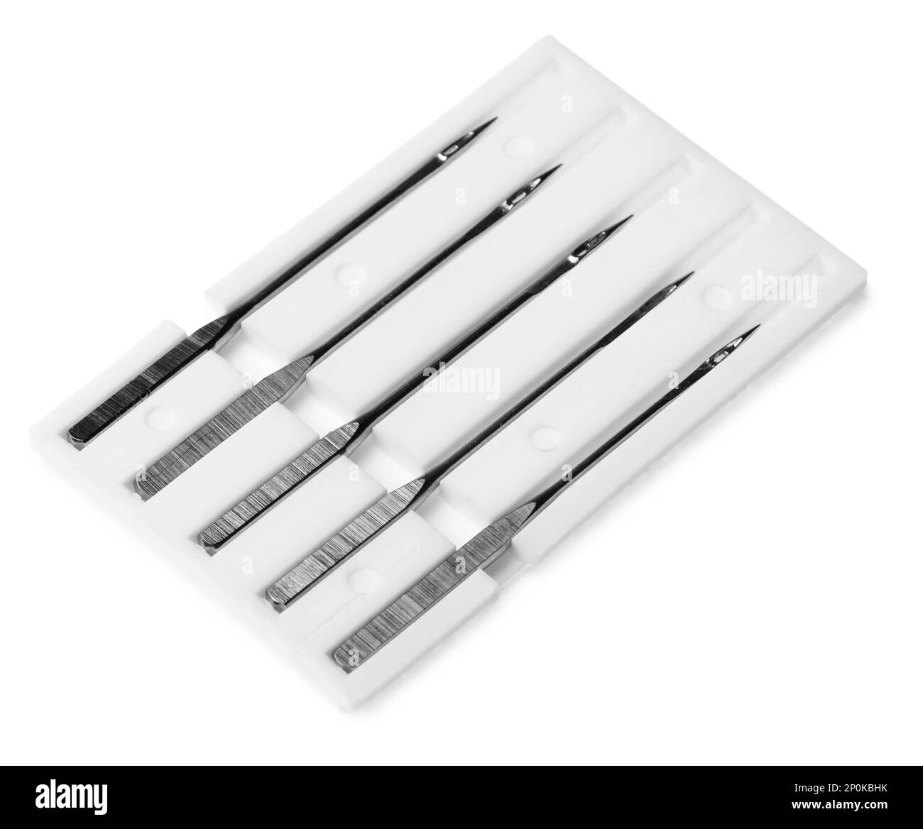 Set of sewing machine needles with package isolated on white Stock