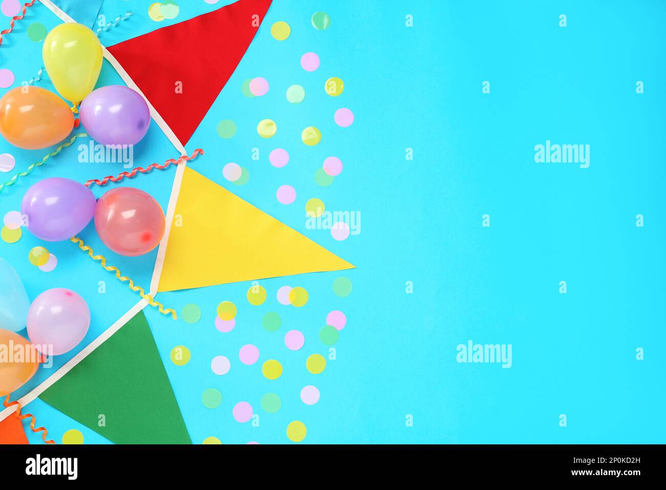 Bunting with colorful triangular flags, balloons, streamers and