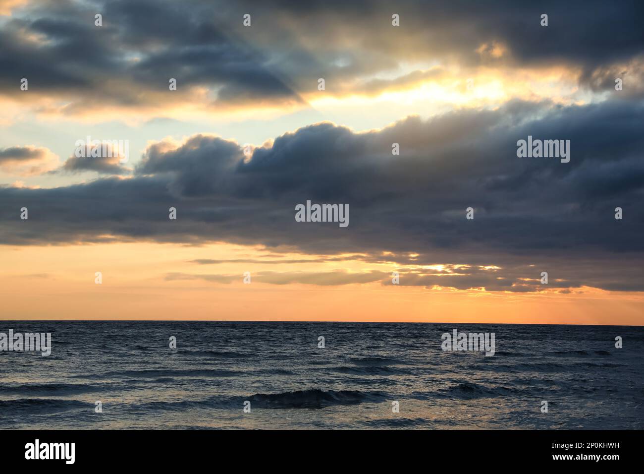 Picturesque view of beautiful sky with clouds over sea at sunset Stock ...