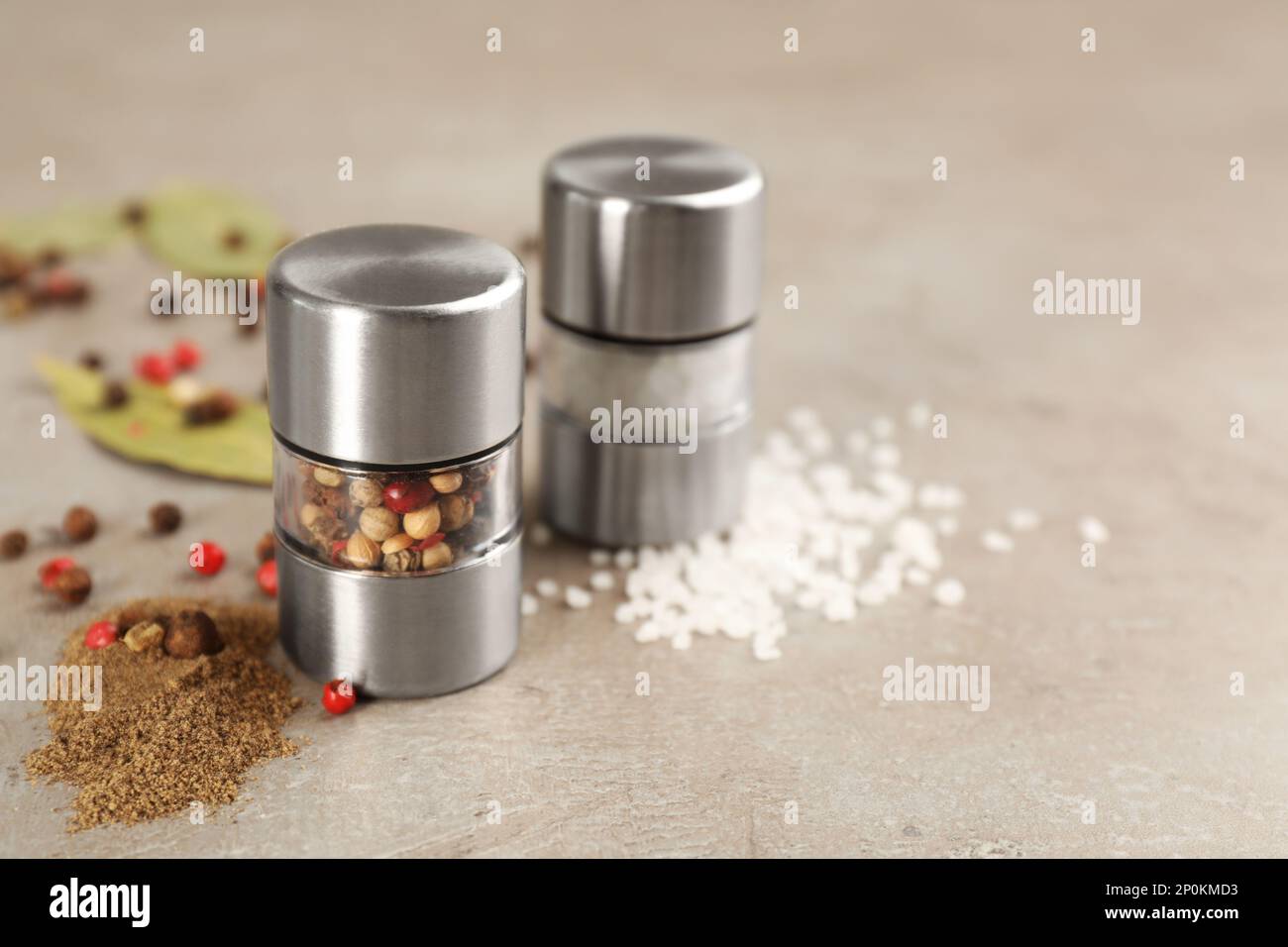 Salt and pepper shakers on light grey table, closeup. Space for text Stock  Photo - Alamy