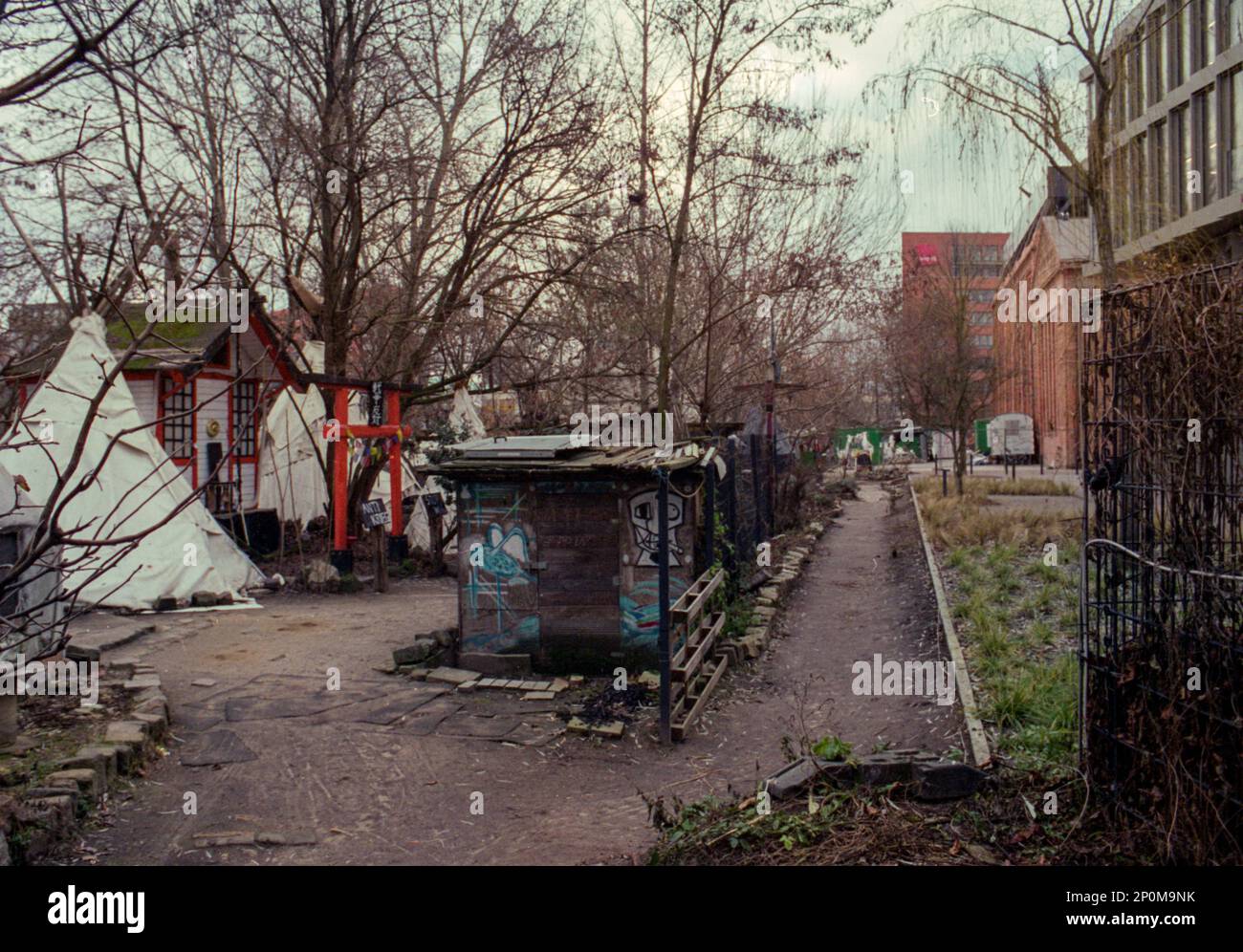 Berlin, Germany. TeePeeLand is a makeshift Squad alongside the Spree River, hosuing up to 16 people permanent in TeePees and Tents, thus forming an alternative and self sustaining community within the City Limits. Stock Photo