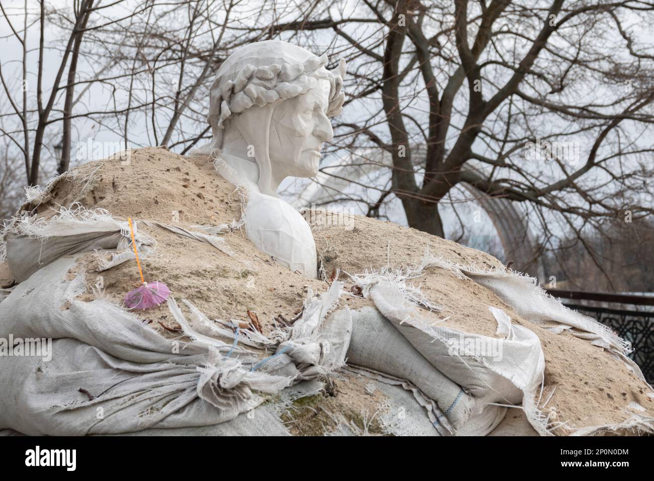 2023-02-28 Kyiv, Ukraine. Dante Alighieri monument  on the hills of Kyiv protected with sand bags from russian shelling and missiles Stock Photo